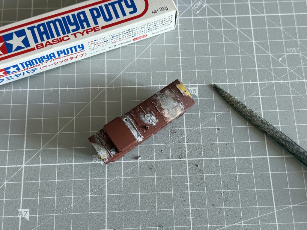 Using Tamiya Putty to fill the whole left by the removed roofwalks.