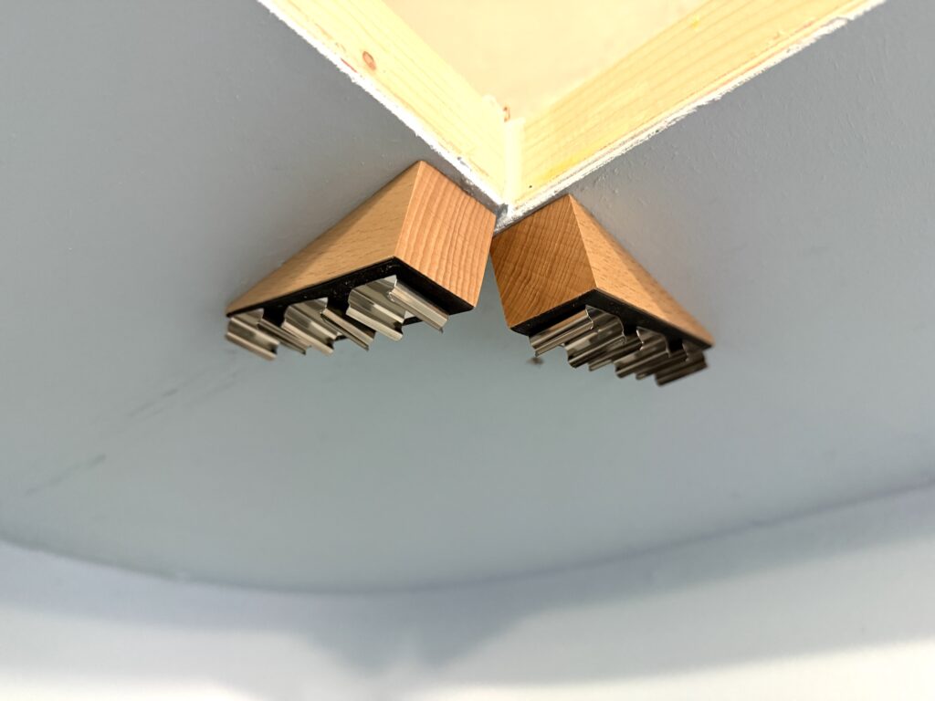 Wooden door wedges used to mount the LED strips at an angle